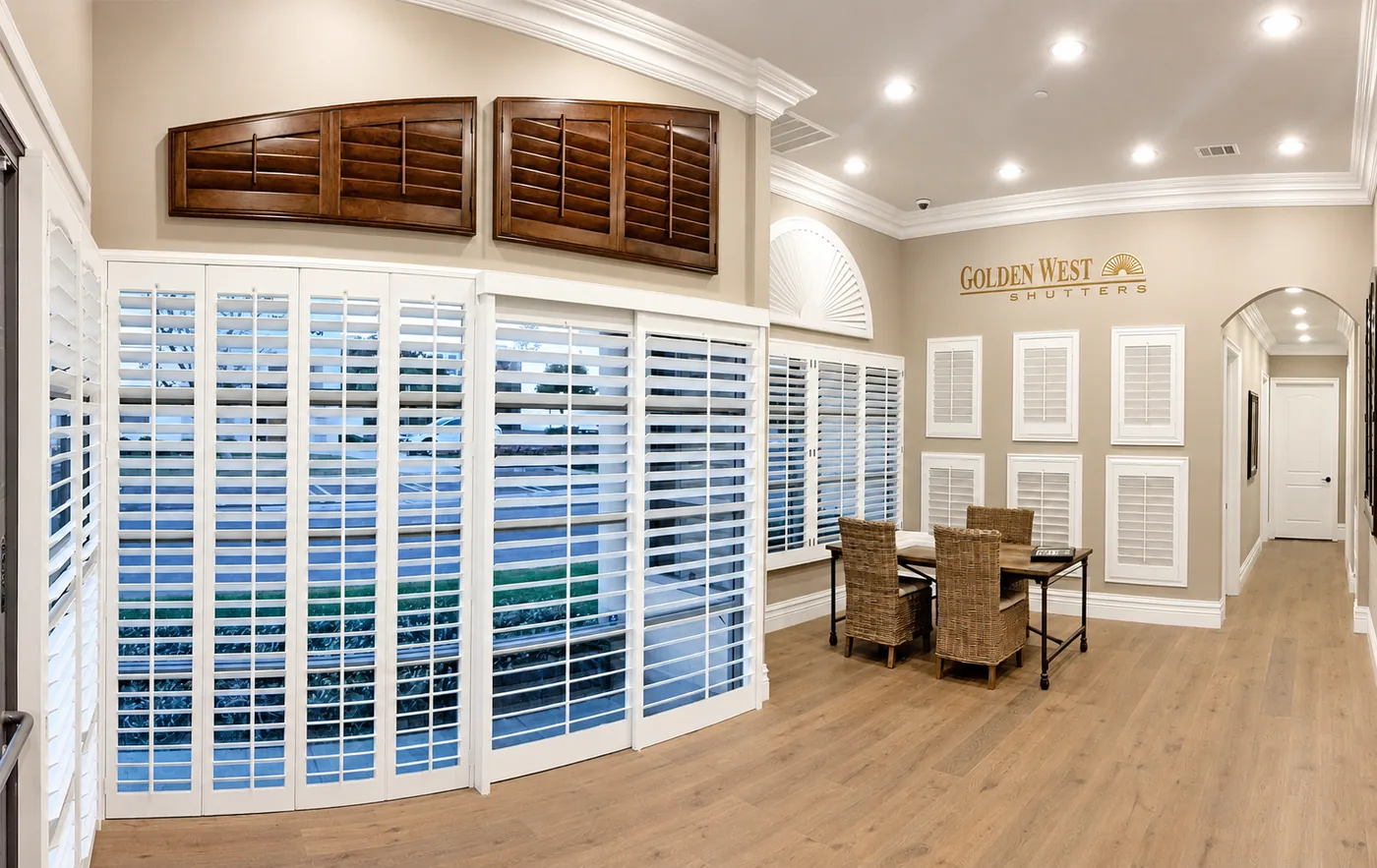Golden West showroom in Lake Forest with full-size white and arched plantation shutters on display